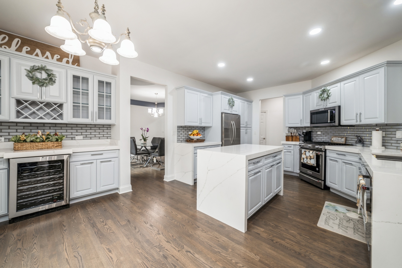 19217 Beck Road Marengo, IL 60152 - Photo 5 of 30 a kitchen with white cabinets and stainless steel appliances