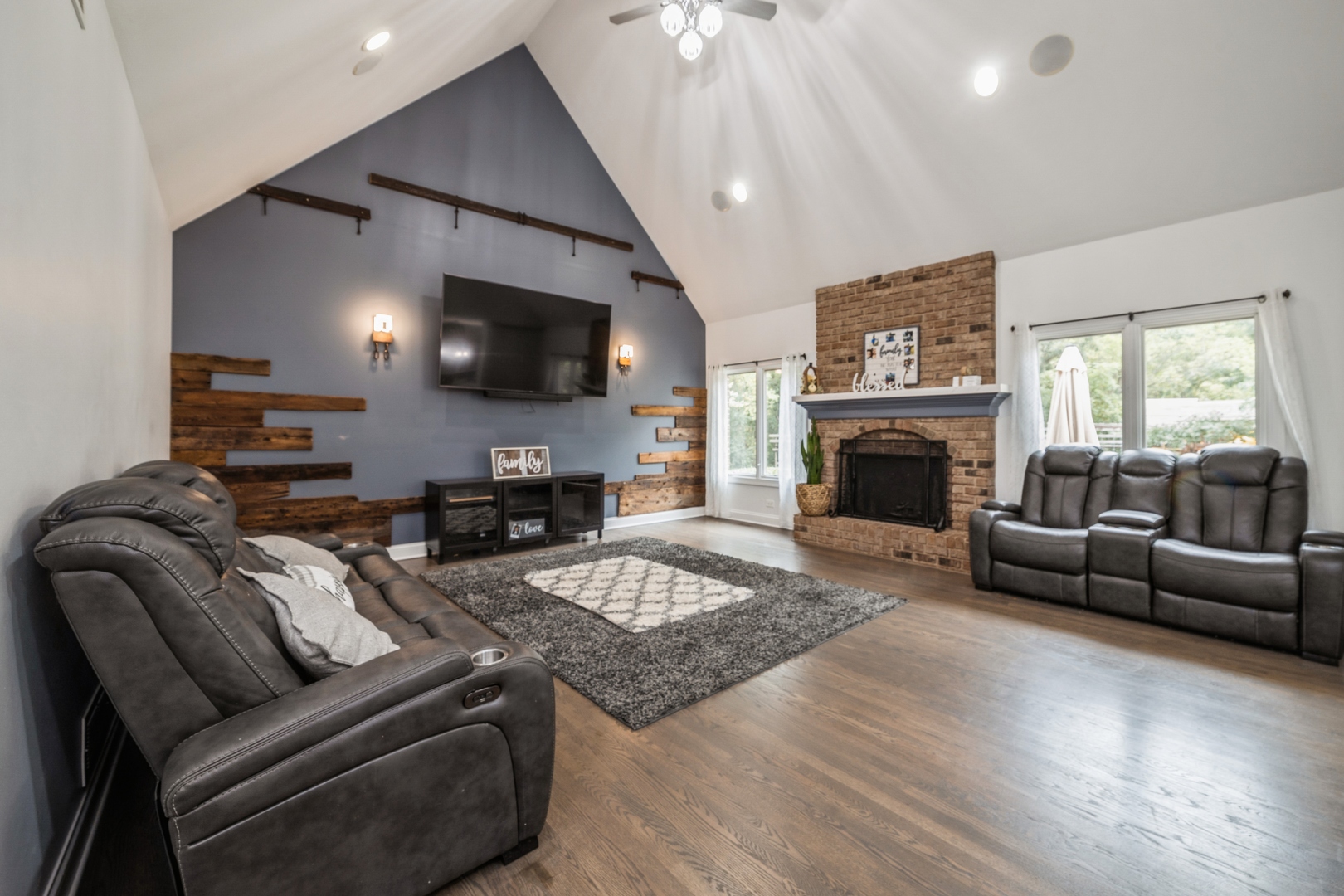 19217 Beck Road Marengo, IL 60152 - Photo 8 of 30 a living room with furniture a flat screen tv and a fireplace