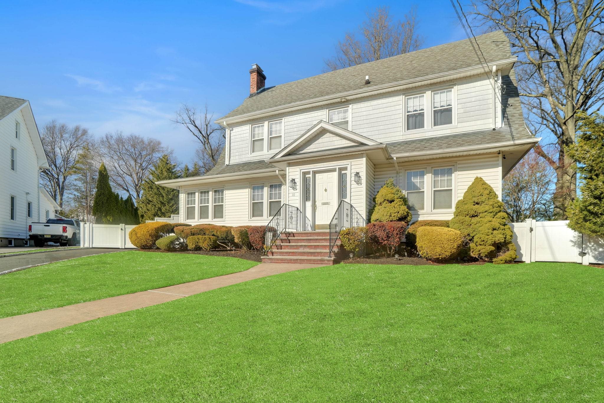 10 Lynn Court Rutherford, NJ 07070 - Photo 1 of 37 a front view of a house with a yard and porch