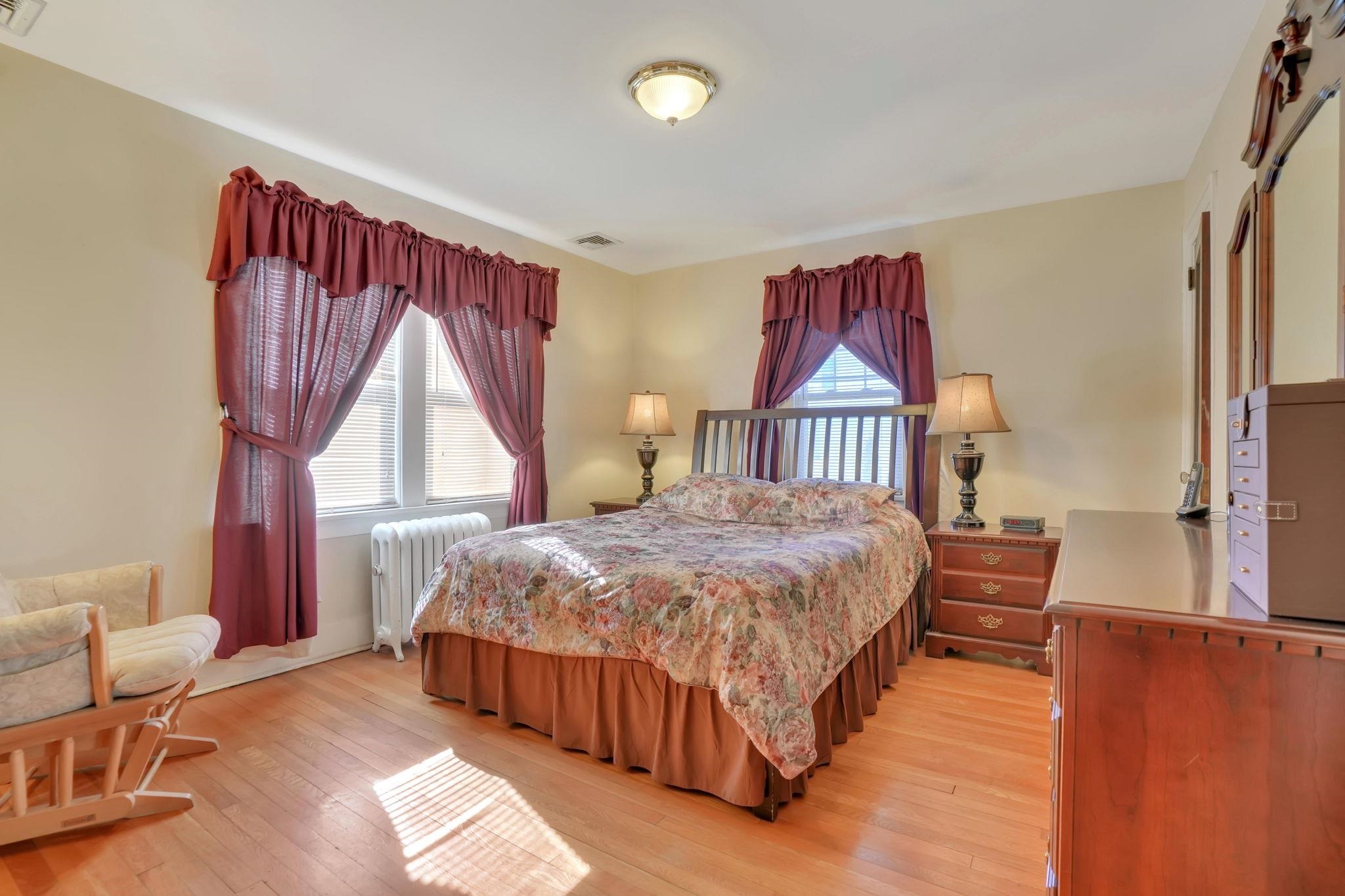 10 Lynn Court Rutherford, NJ 07070 - Photo 16 of 37 a bedroom with a bed and a window