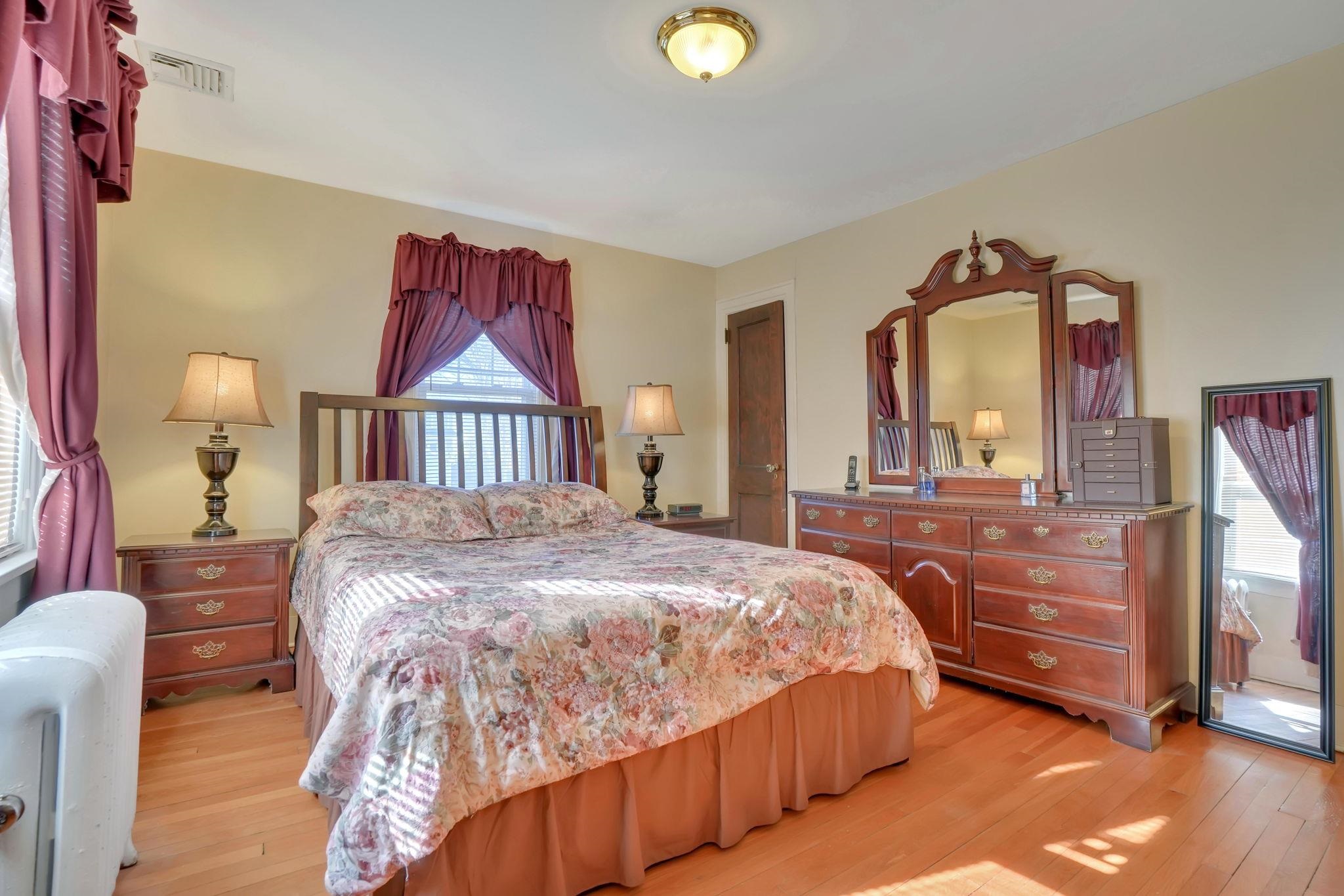 10 Lynn Court Rutherford, NJ 07070 - Photo 17 of 37 a bedroom with a bed and a dresser