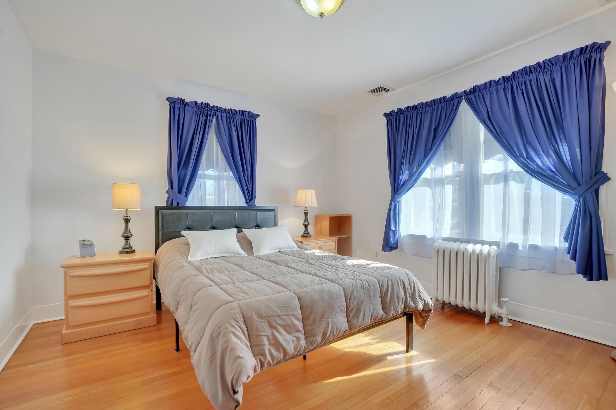 10 Lynn Court Rutherford, NJ 07070 - Photo 19 of 37 a bedroom with a bed and a window