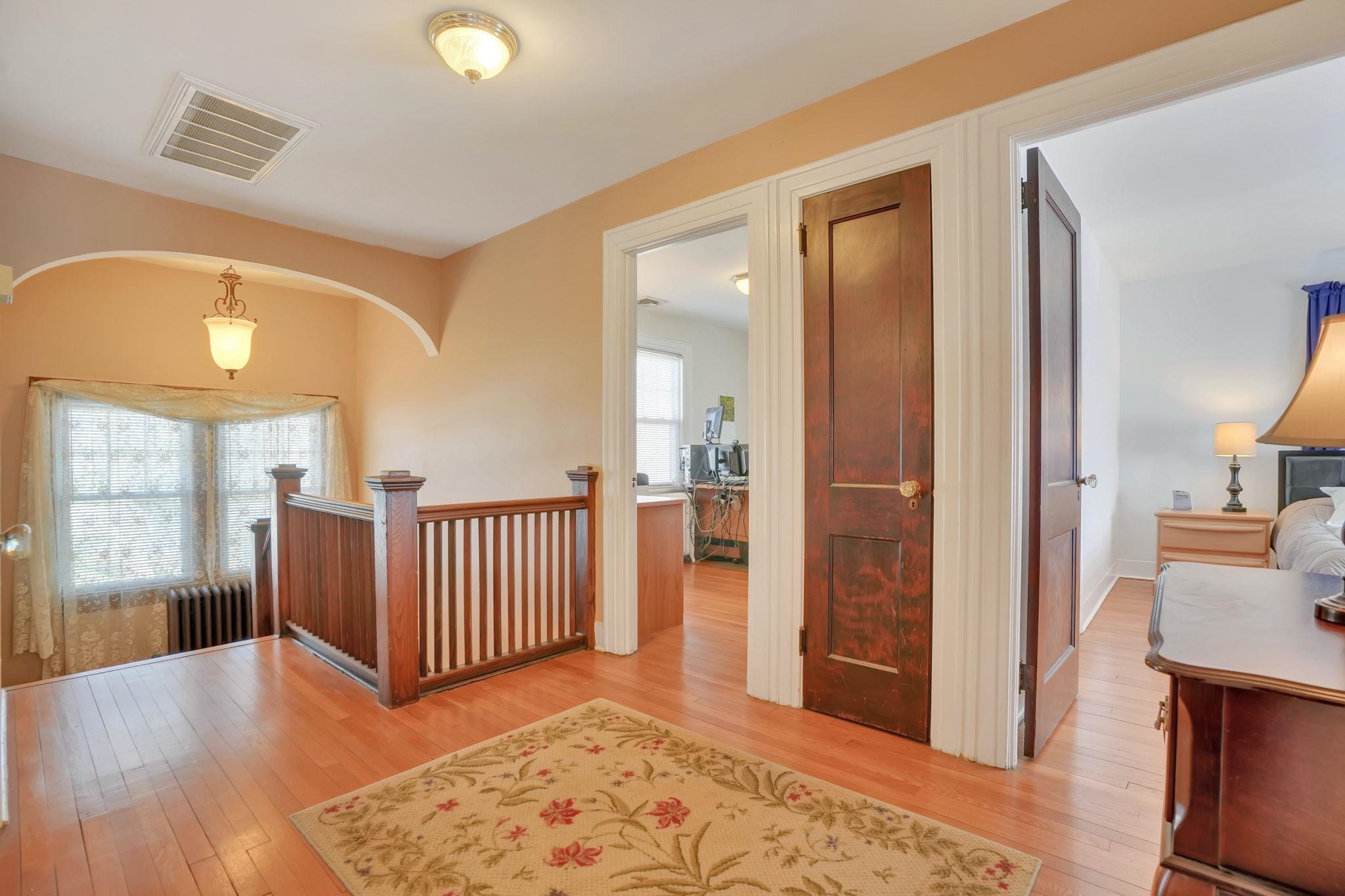 10 Lynn Court Rutherford, NJ 07070 - Photo 22 of 37 a view of a hallway with wooden floor and windows