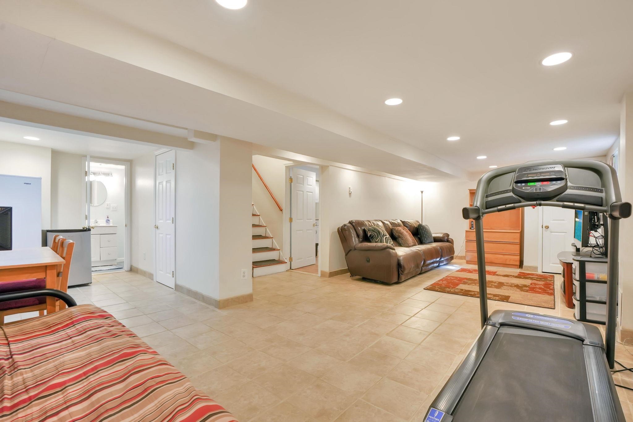 10 Lynn Court Rutherford, NJ 07070 - Photo 26 of 37 a bedroom with furniture and a chandelier