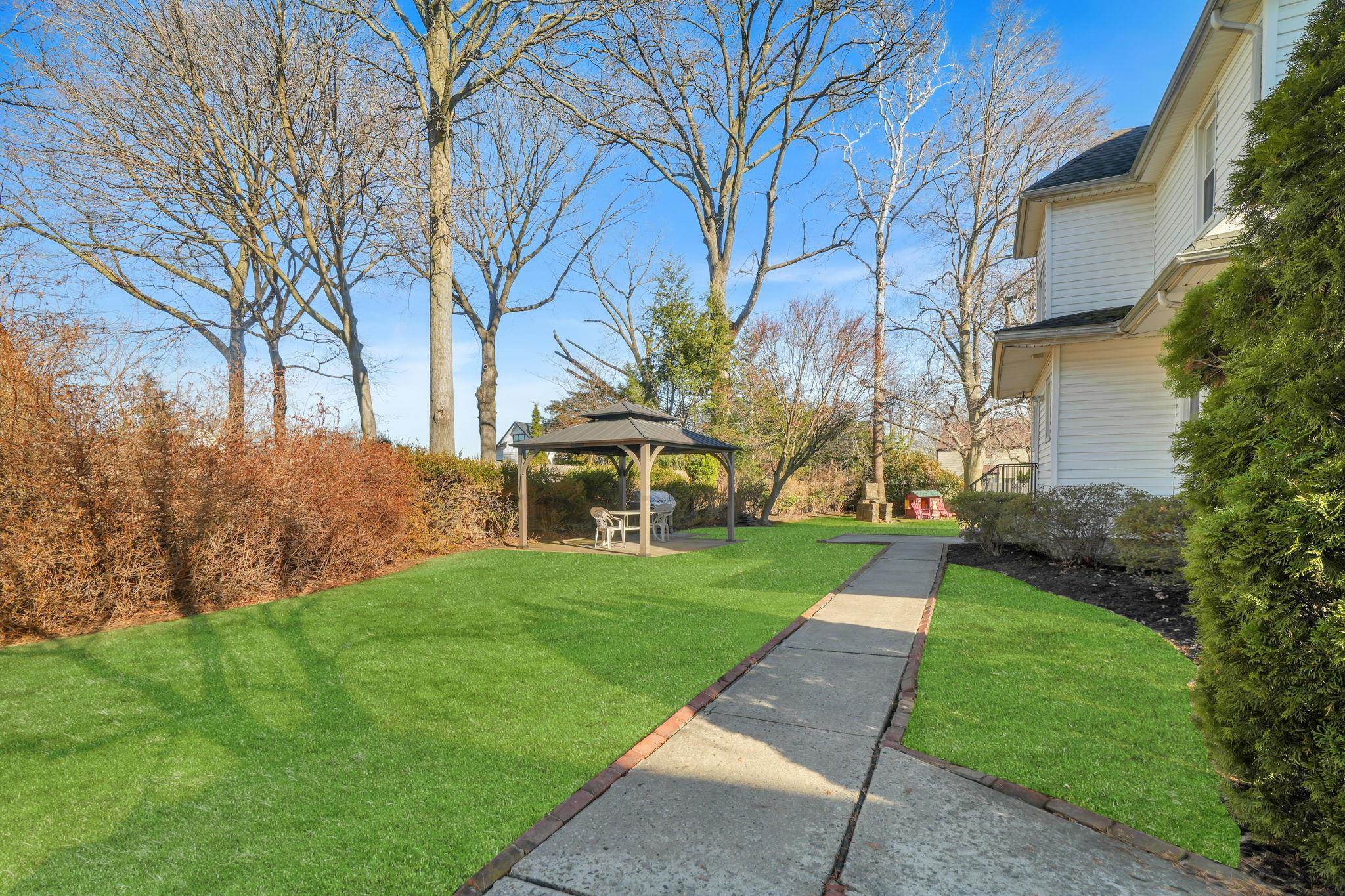10 Lynn Court Rutherford, NJ 07070 - Photo 34 of 37 a view of a white house with a yard