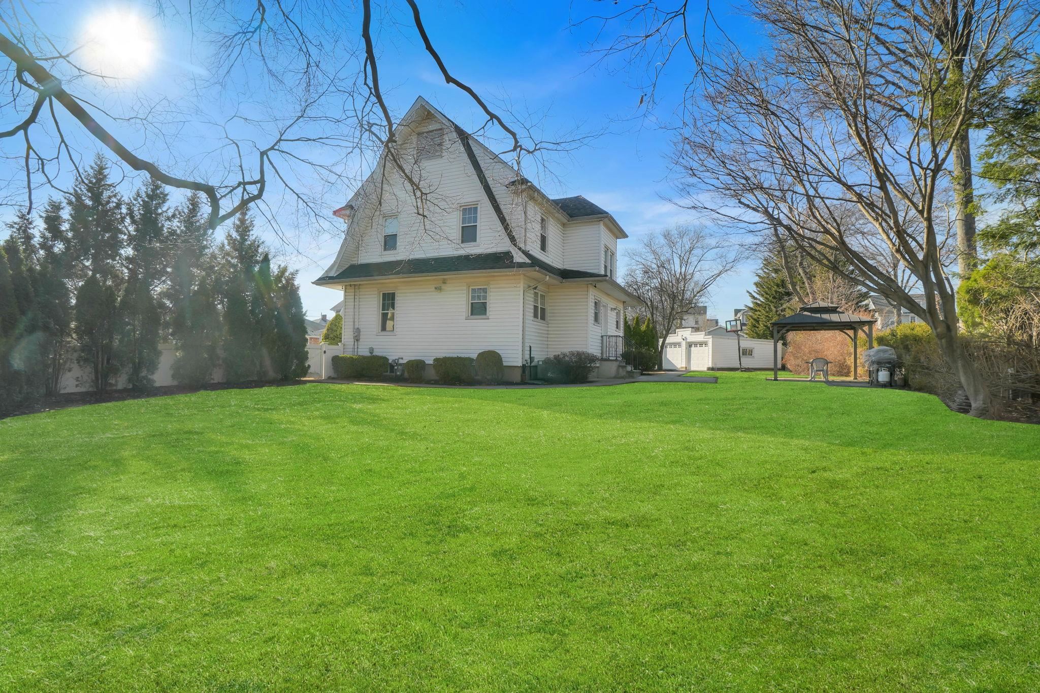 10 Lynn Court Rutherford, NJ 07070 - Photo 37 of 37 a view of a house with a big yard plants and large tree