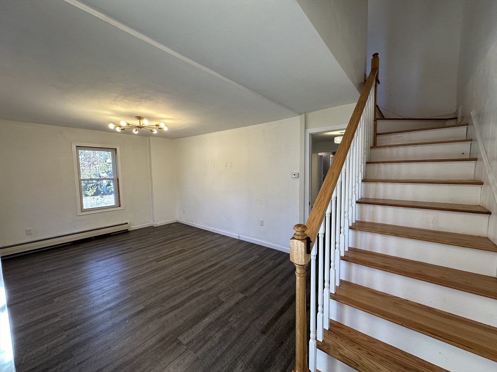 8 Pike Street Hopkinton, MA 01748 - Photo 4 of 34 a view of entryway with wooden floor and stairs