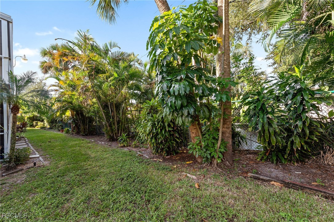 2828 Jackson Street, Unit D8 Fort Myers, FL 33901 - Photo 29 of 37 a view of a yard with a tree