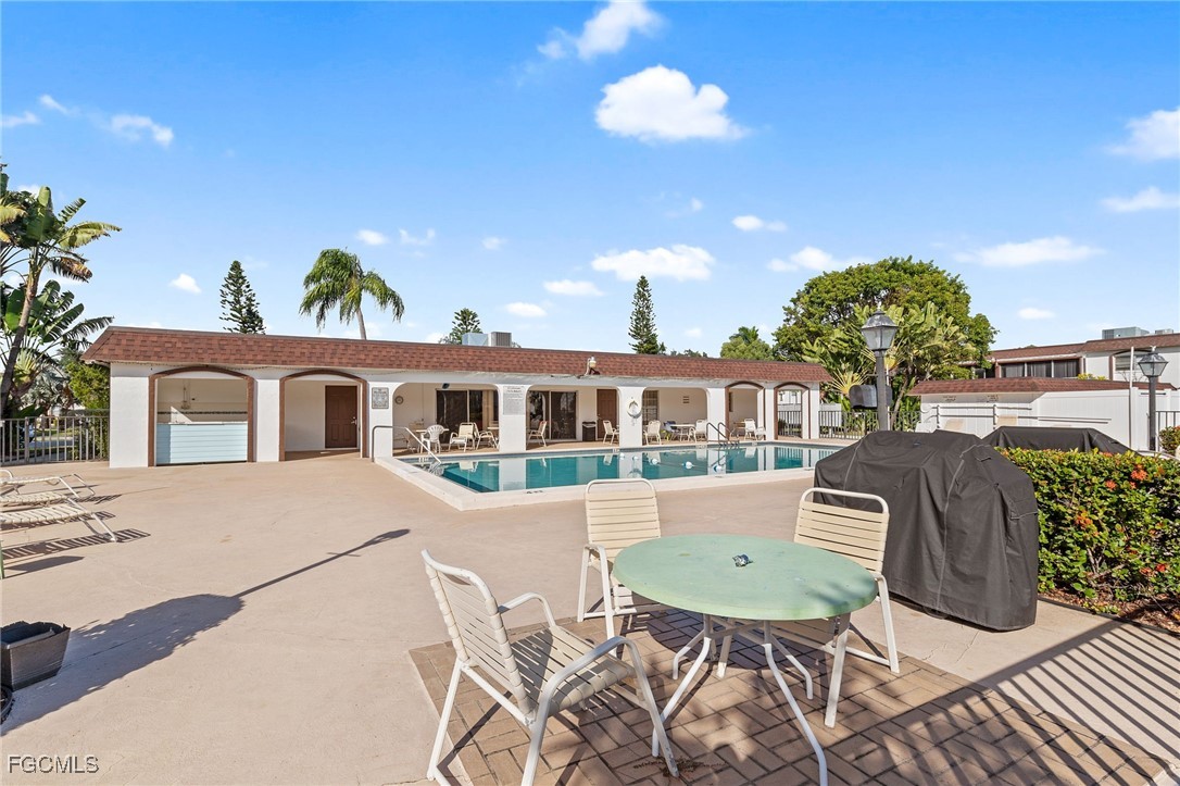 2828 Jackson Street, Unit D8 Fort Myers, FL 33901 - Photo 33 of 37 a front view of a house with garden