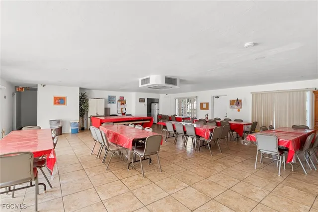 a kitchen with stainless steel appliances kitchen island granite countertop a refrigerator and a stove