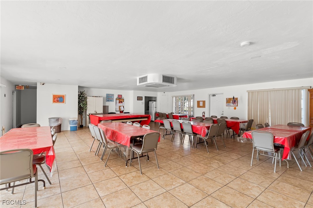 2828 Jackson Street, Unit D8 Fort Myers, FL 33901 - Photo 36 of 37 a living room with furniture and kitchen view