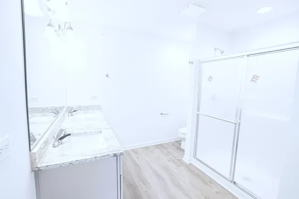 a bathroom with a bathtub and shower