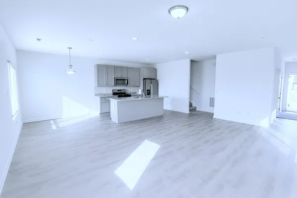 a view of a kitchen with a sink and a stove top oven