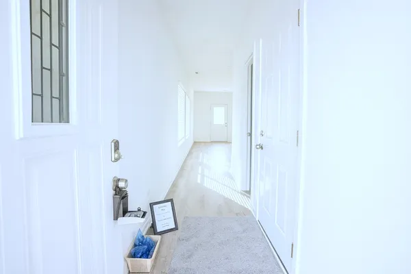 a view of a hallway with staircase