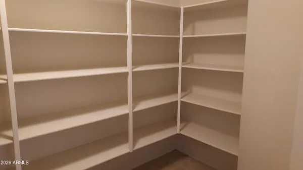 a view of an empty walk in closet
