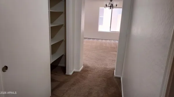 a view of an empty room with a window