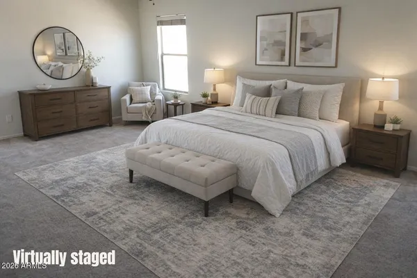 a bedroom with a bed a mirror and a window