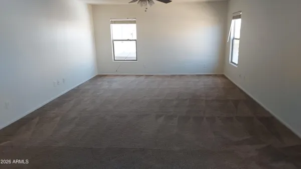 a view of an empty room and a window