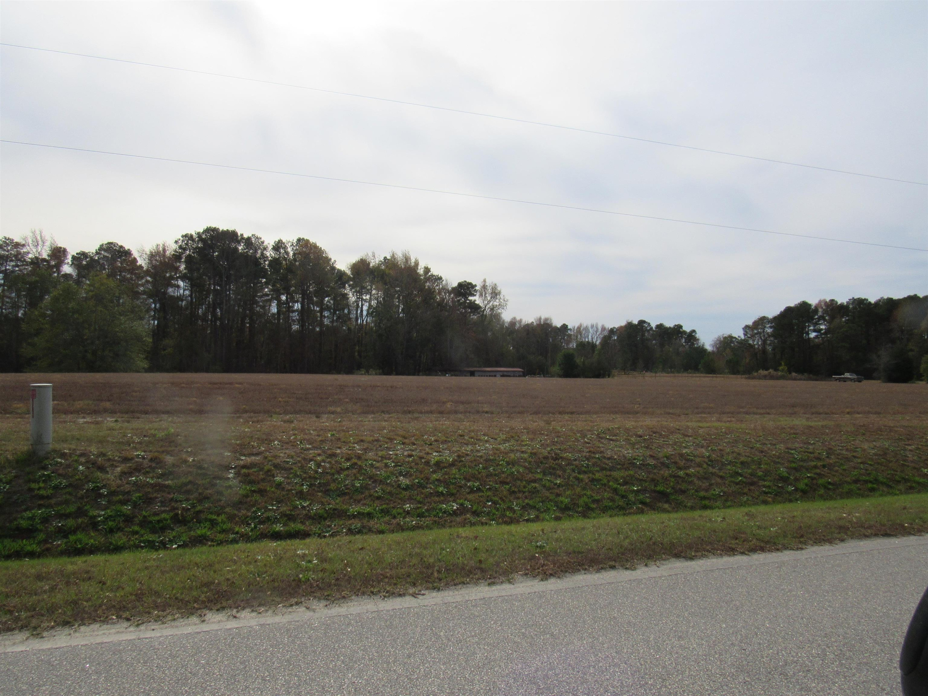 257 Johnson Estate Road Clayton, NC 27520 - Photo 2 of 7 a view of lake with green space