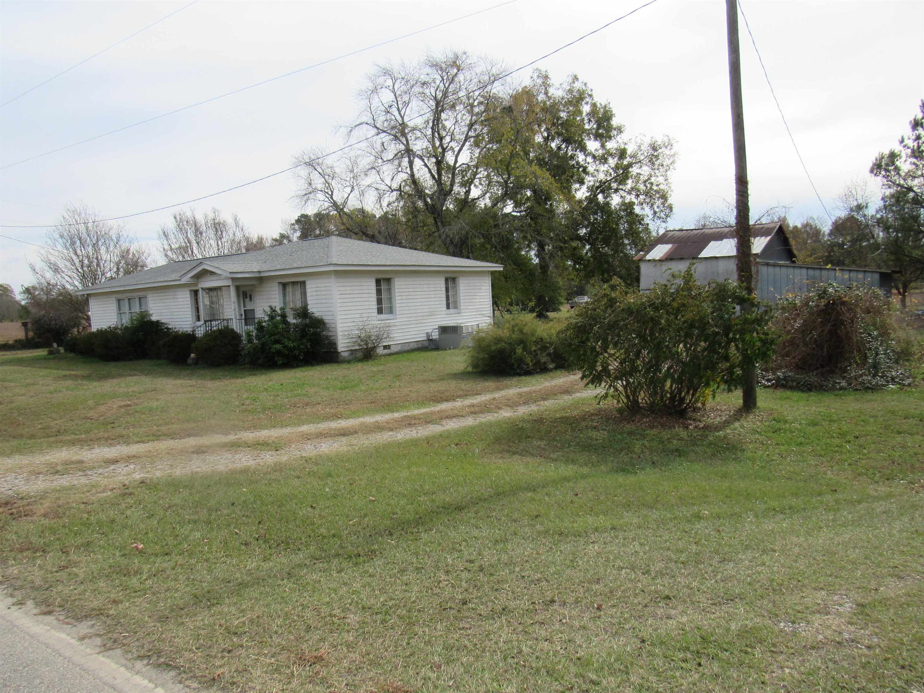 257 Johnson Estate Road Clayton, NC 27520 - Photo 7 of 7 a view of a house with a yard