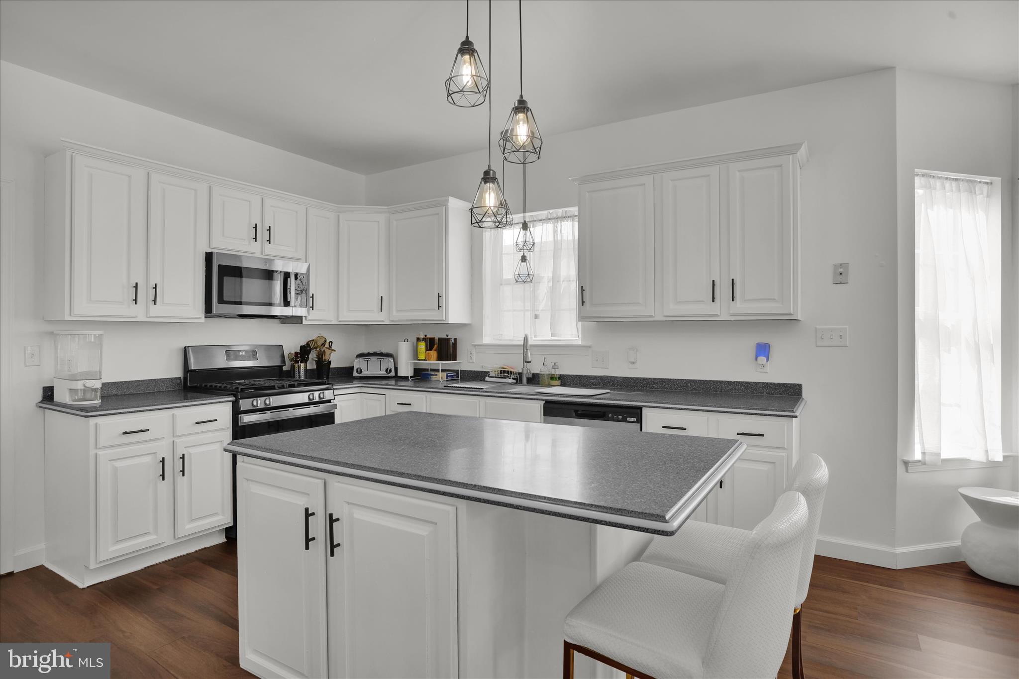 36 Hayden Circle Reading, PA 19606 - Photo 10 of 41 a kitchen with granite countertop a center island white cabinets and wooden floor