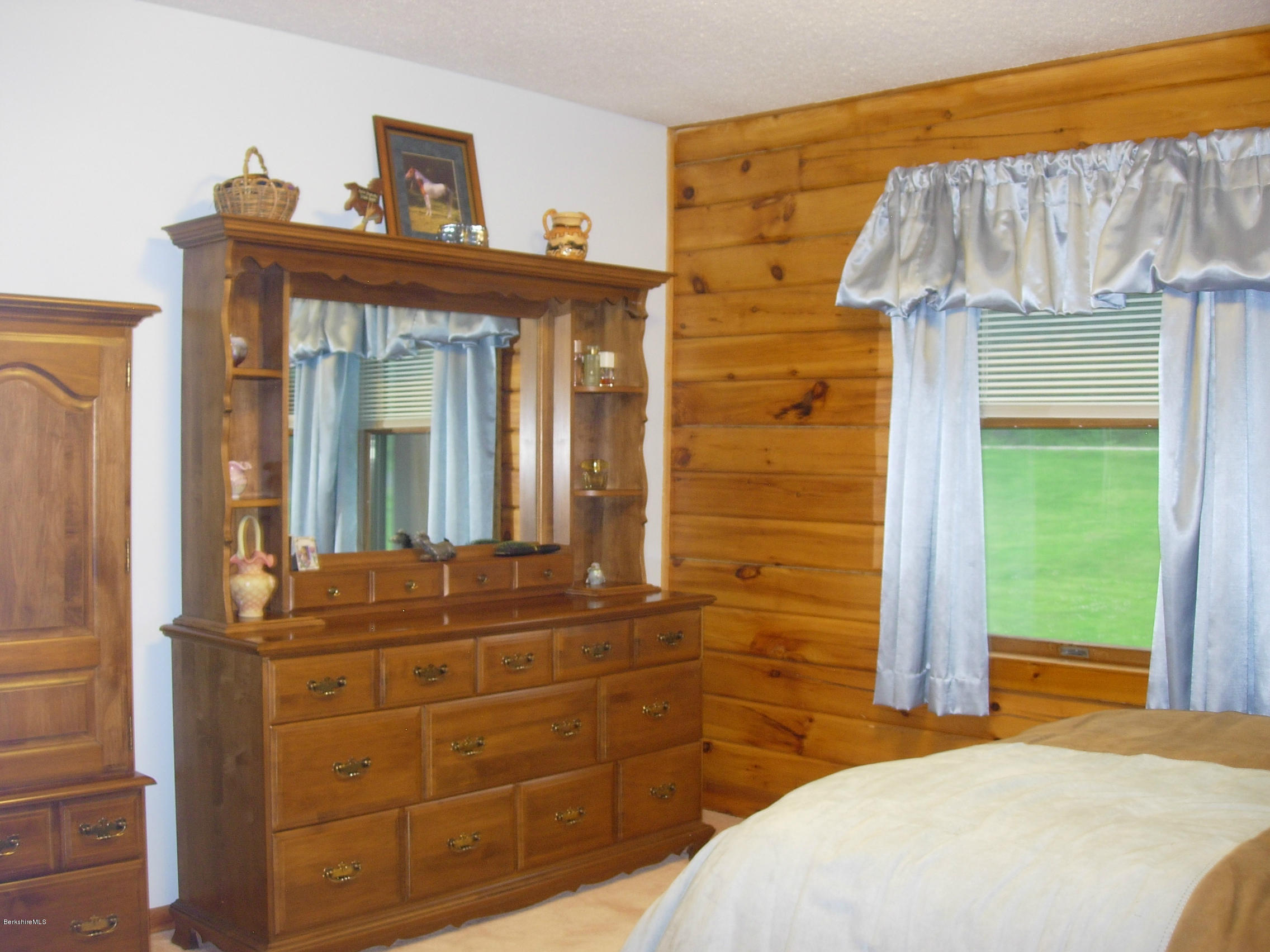 99 Strykers Road Florida, MA 01247 - Photo 16 of 26 a bedroom with a bed and a window