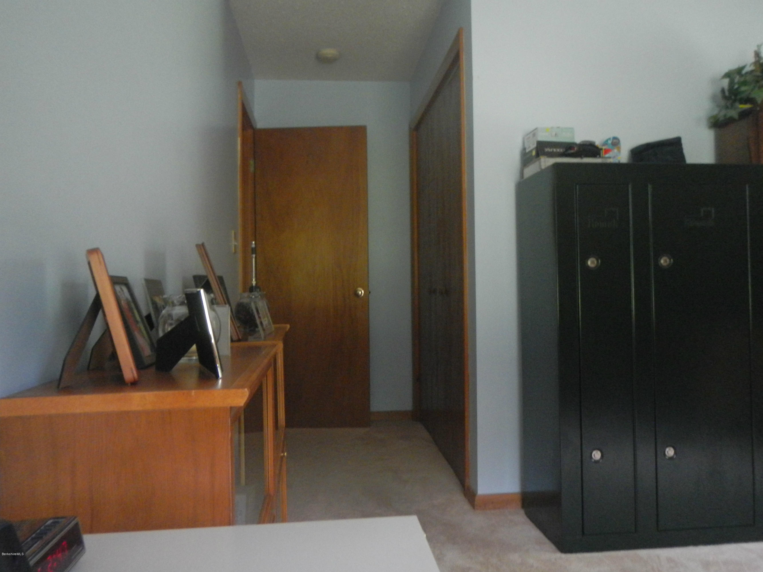 99 Strykers Road Florida, MA 01247 - Photo 18 of 26 a view of an empty room and wooden floor
