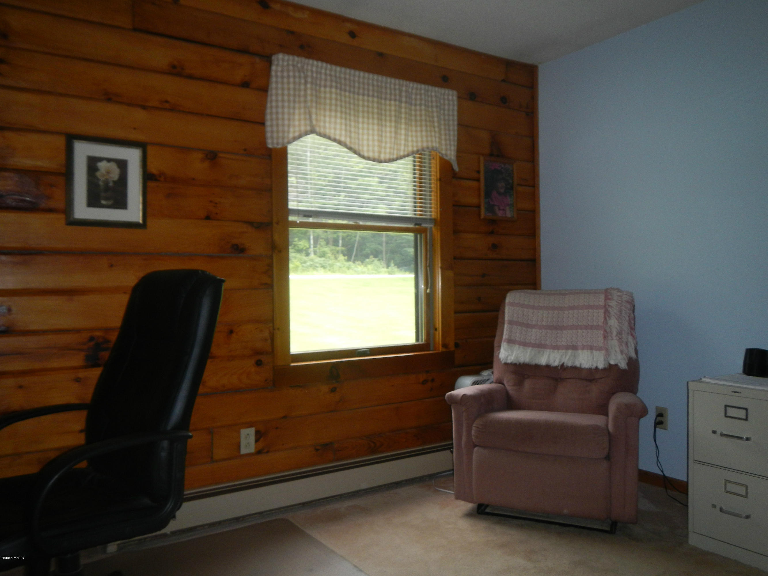 99 Strykers Road Florida, MA 01247 - Photo 19 of 26 a living room with furniture and a window