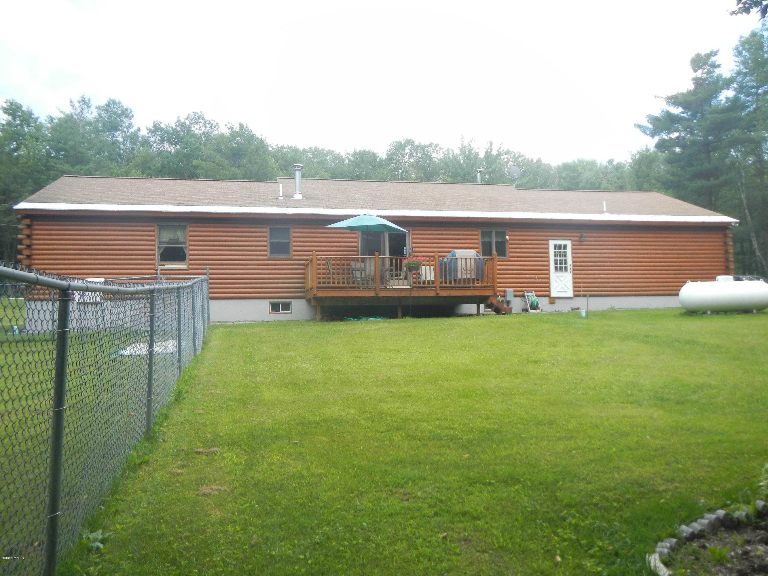 99 Strykers Road Florida, MA 01247 - Photo 24 of 26 a front view of house with yard and green space