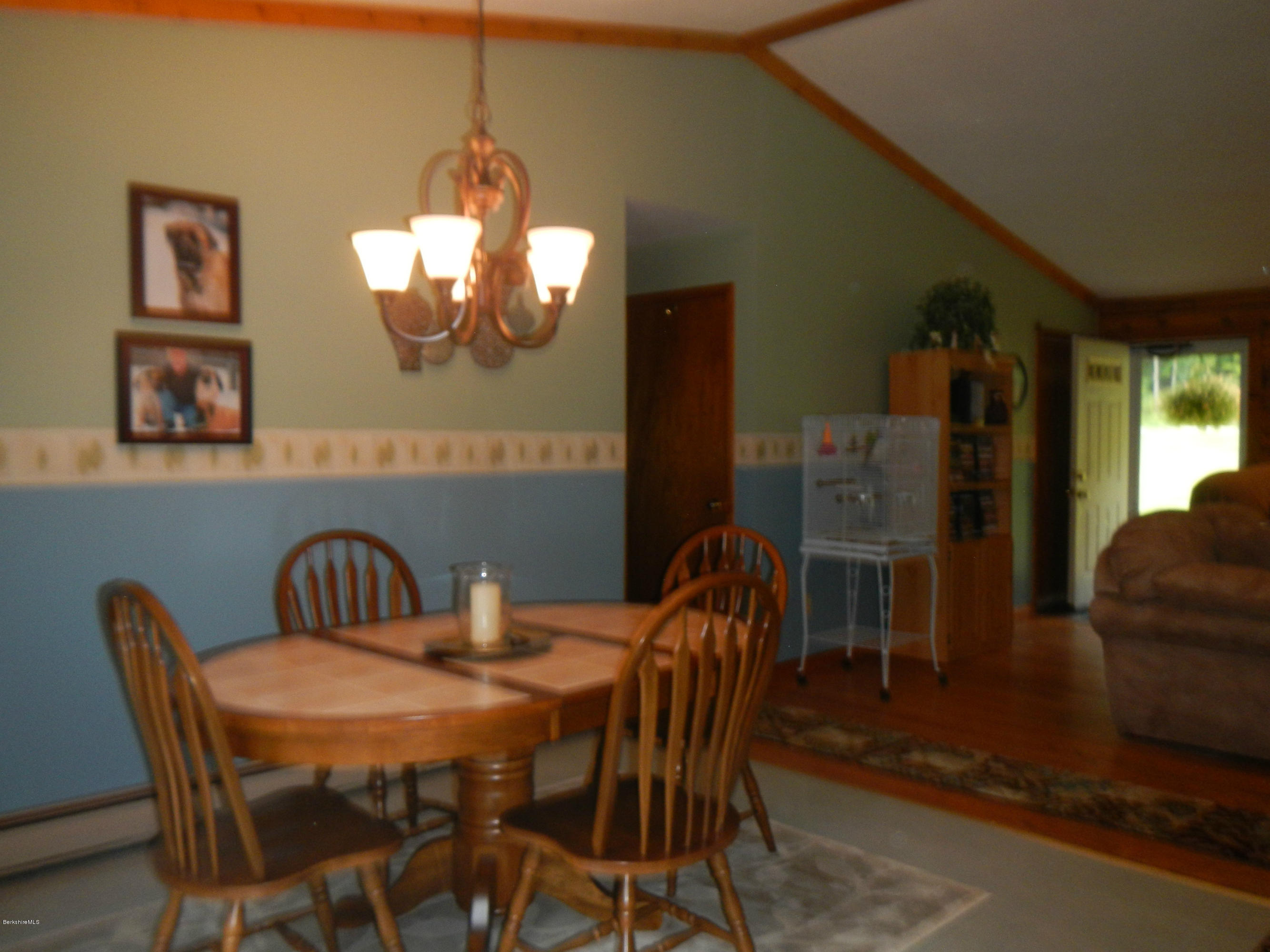99 Strykers Road Florida, MA 01247 - Photo 5 of 26 a view of a dining room with furniture and window