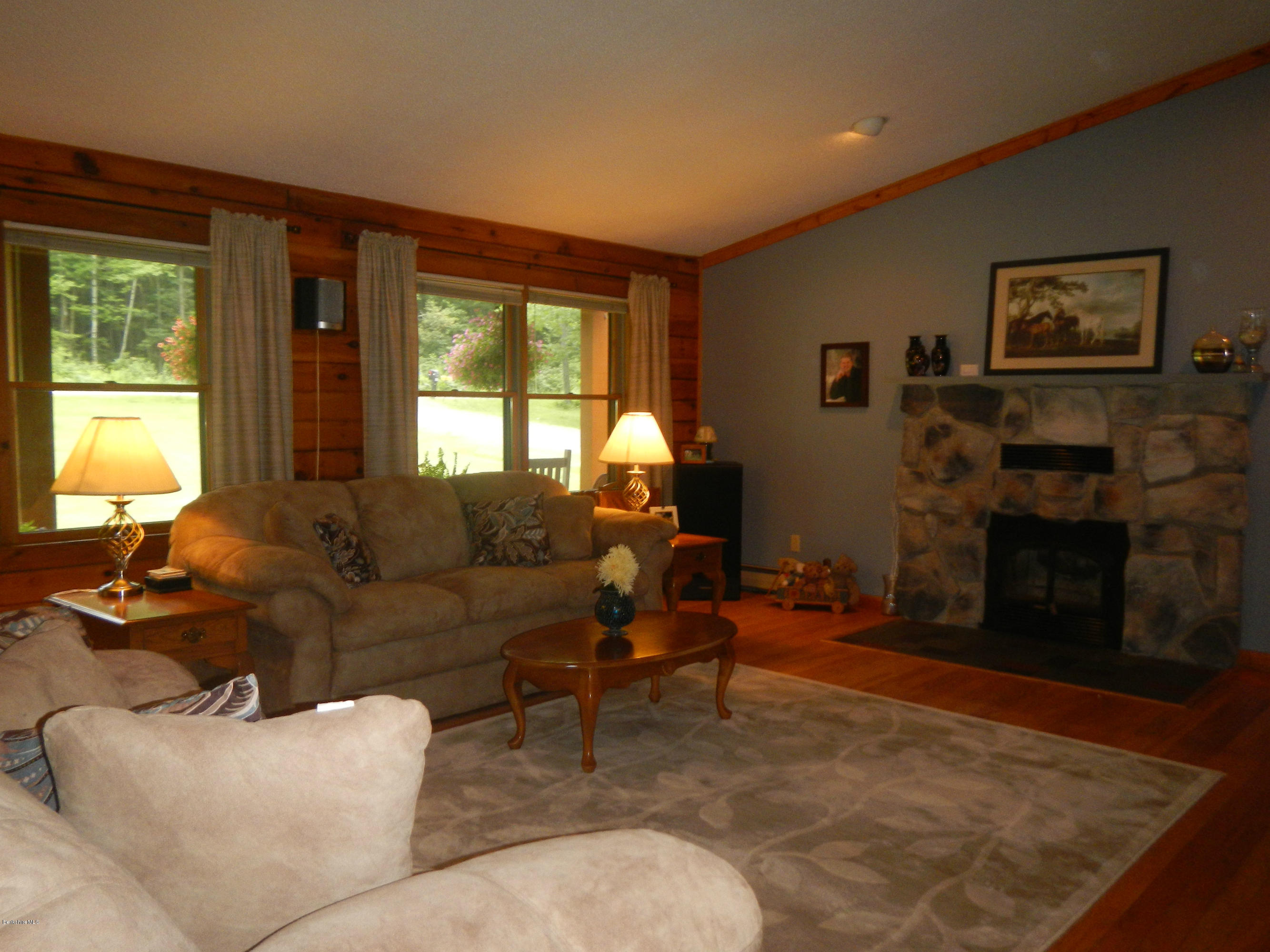 99 Strykers Road Florida, MA 01247 - Photo 9 of 26 a living room with furniture window and a fireplace