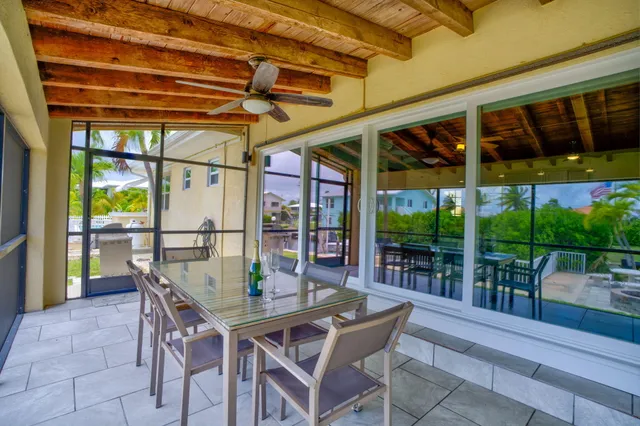 a view of a patio with a table and chairs