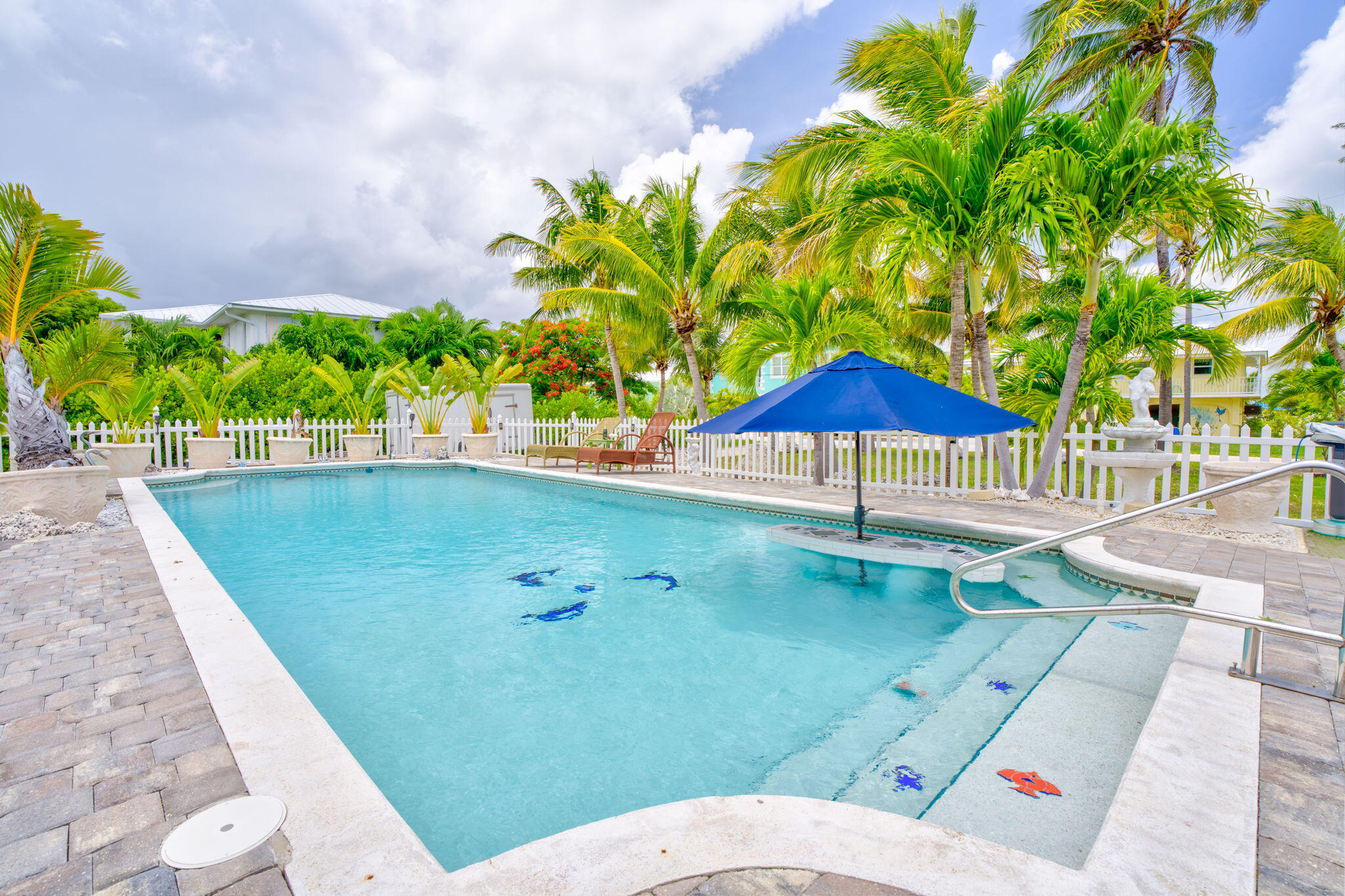 30366 Falcon Lane Big Pine Key, FL 33043 - Photo 2 of 45 a view of a swimming pool with a patio