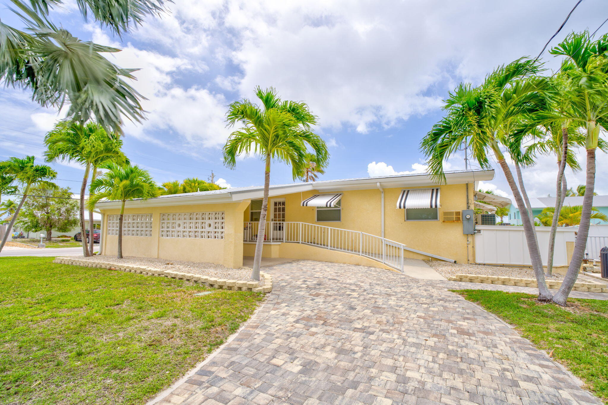 30366 Falcon Lane Big Pine Key, FL 33043 - Photo 35 of 45 a front view of a house with a garden and trees
