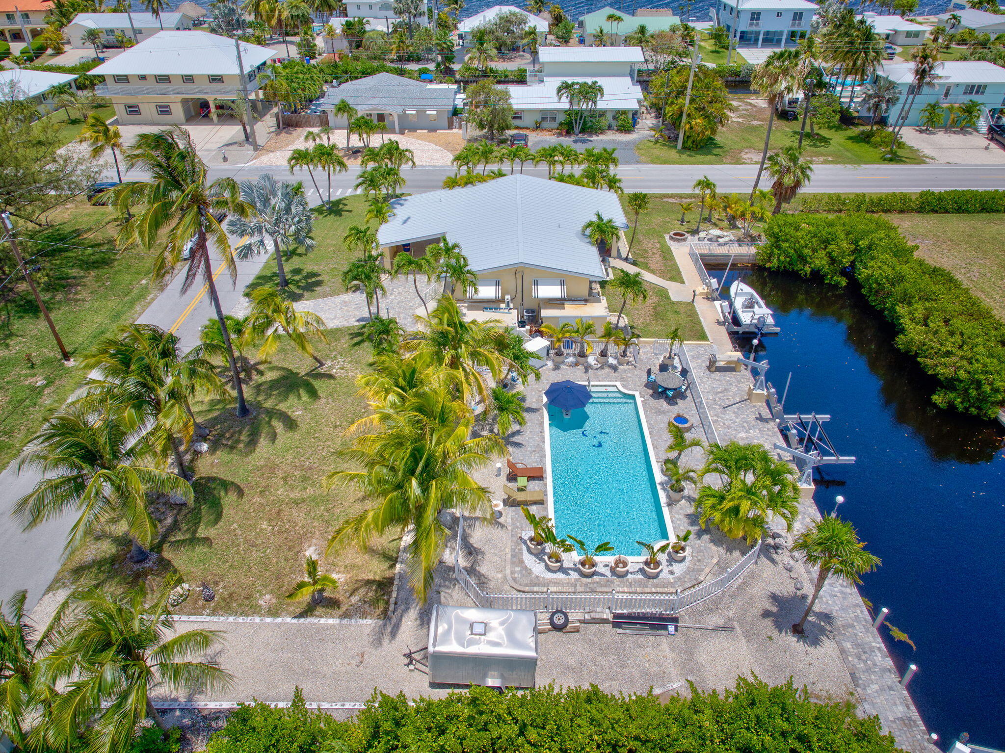 30366 Falcon Lane Big Pine Key, FL 33043 - Photo 40 of 45 an aerial view of a house with a garden and lake view
