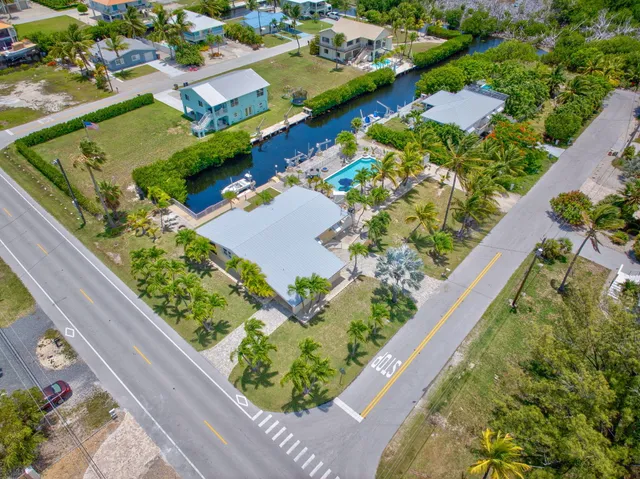an aerial view of residential houses with outdoor space