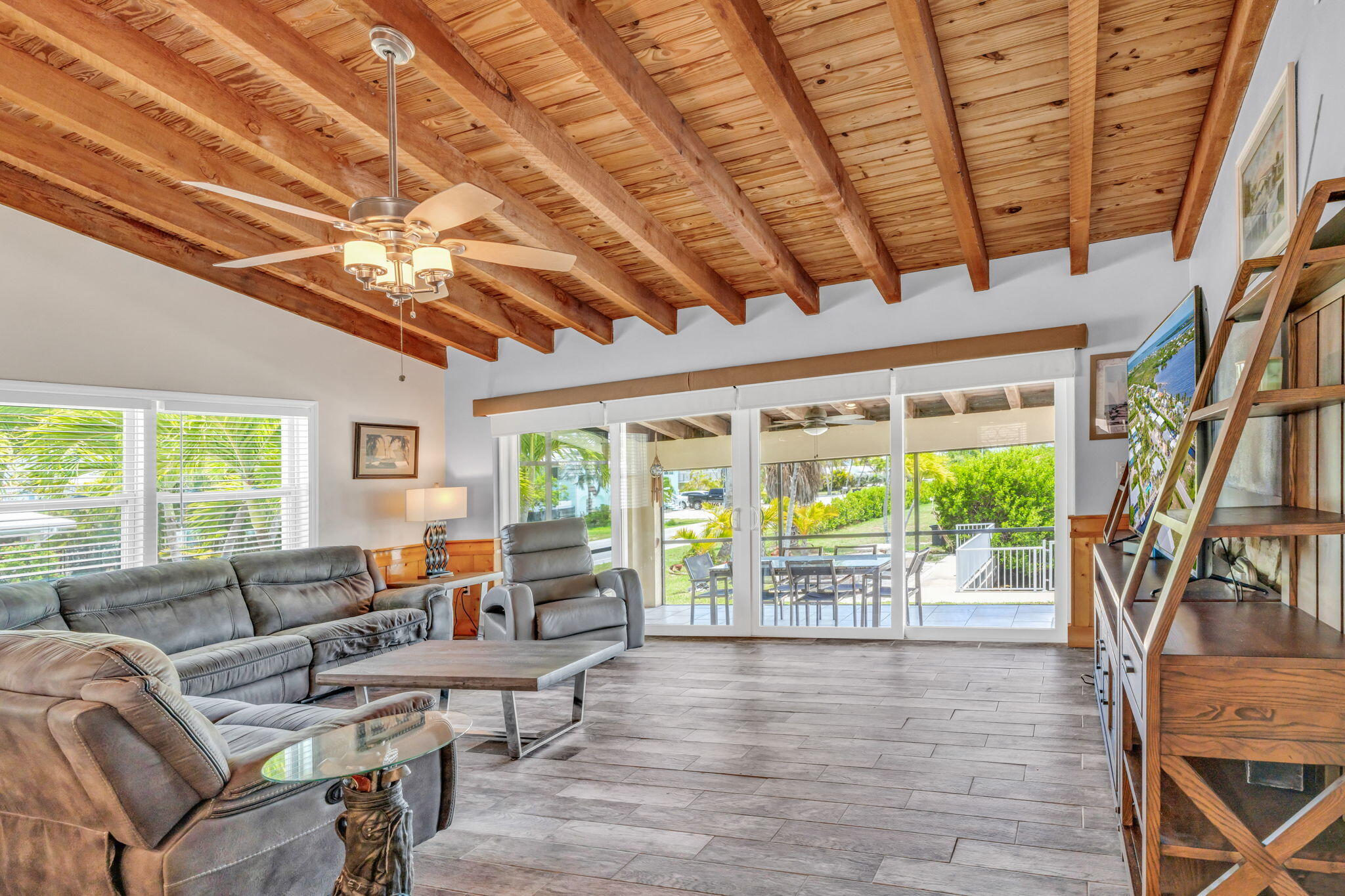 30366 Falcon Lane Big Pine Key, FL 33043 - Photo 6 of 45 a living room with furniture tv and large windows