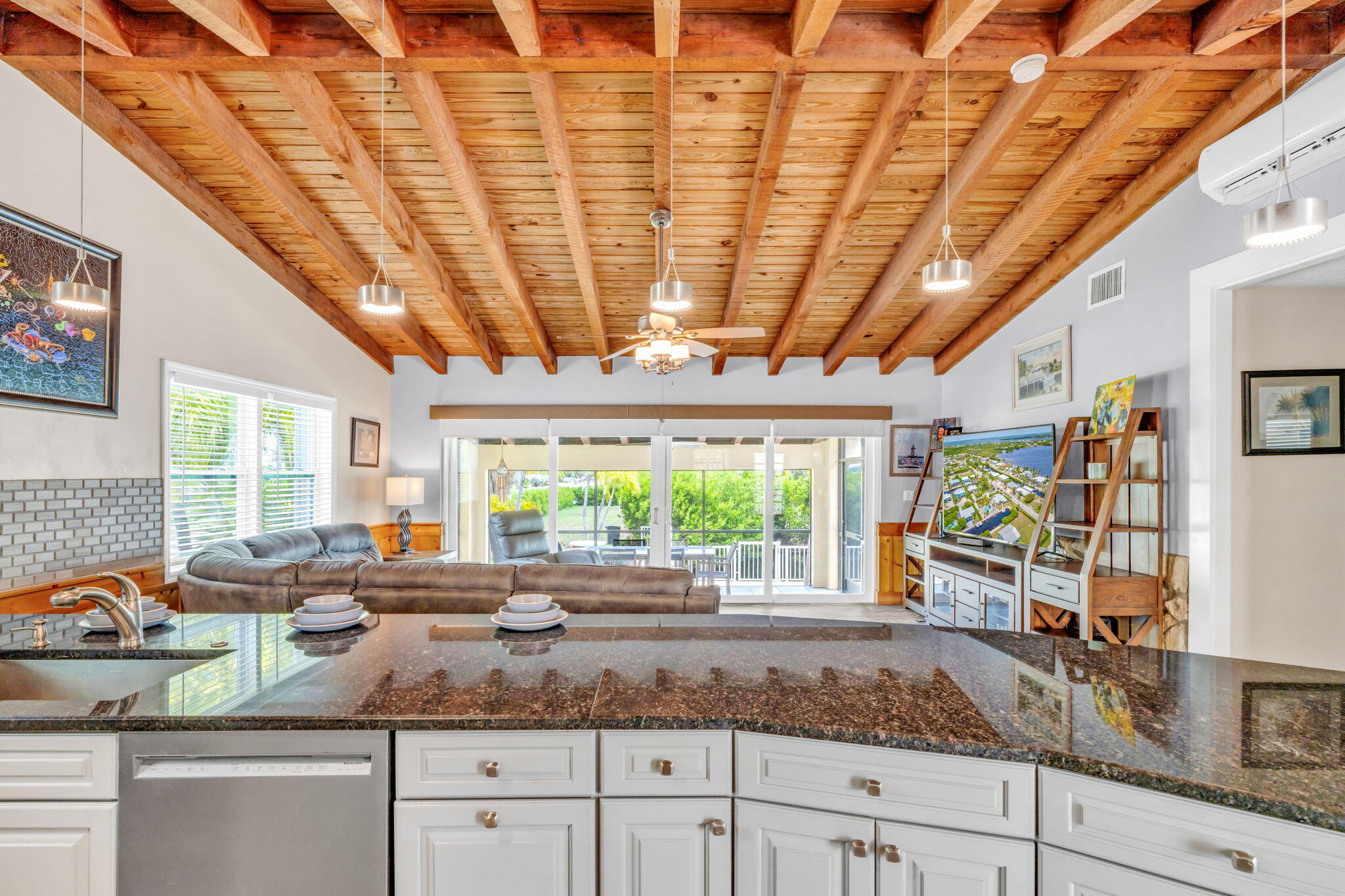 30366 Falcon Lane Big Pine Key, FL 33043 - Photo 8 of 45 a kitchen with stainless steel appliances granite countertop a sink window and cabinets