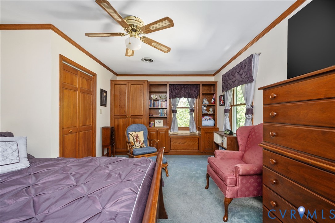 1801 Georgetown Road Heathsville, VA 22473 - Photo 71 of 83 Built-in shelving, wood-paneled closet doors, and