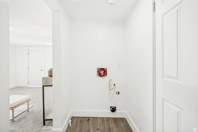 712 9th Street Ogden, UT 84404 - Photo 10 of 15 Dedicated utility area featuring wood-finish flooring and bright white walls