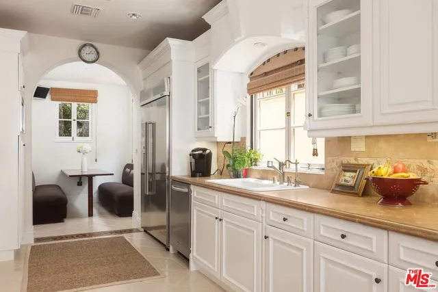 a kitchen with stainless steel appliances lots of counter top space