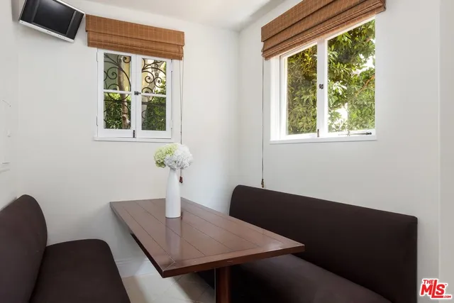 a view of a workspace room with a window