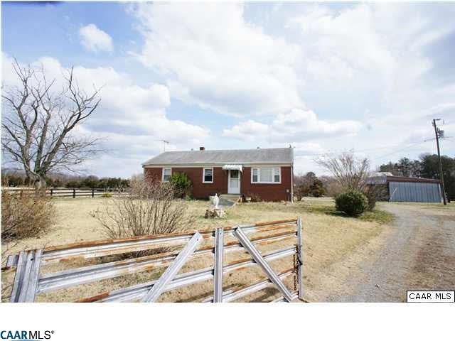 810 Chopping Road Mineral, VA 23117 - Photo 1 of 20 a view of a house next to a lake with a big yard