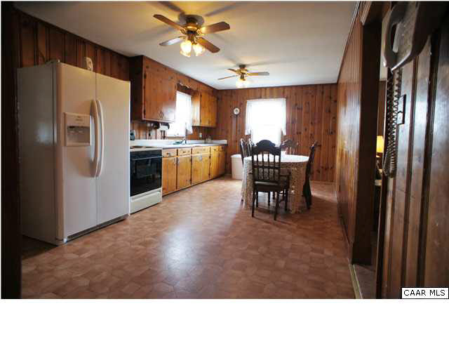 810 Chopping Road Mineral, VA 23117 - Photo 2 of 20 a kitchen with stainless steel appliances kitchen island granite countertop a refrigerator a stove a sink dishwasher a dining table and chairs with wooden floor