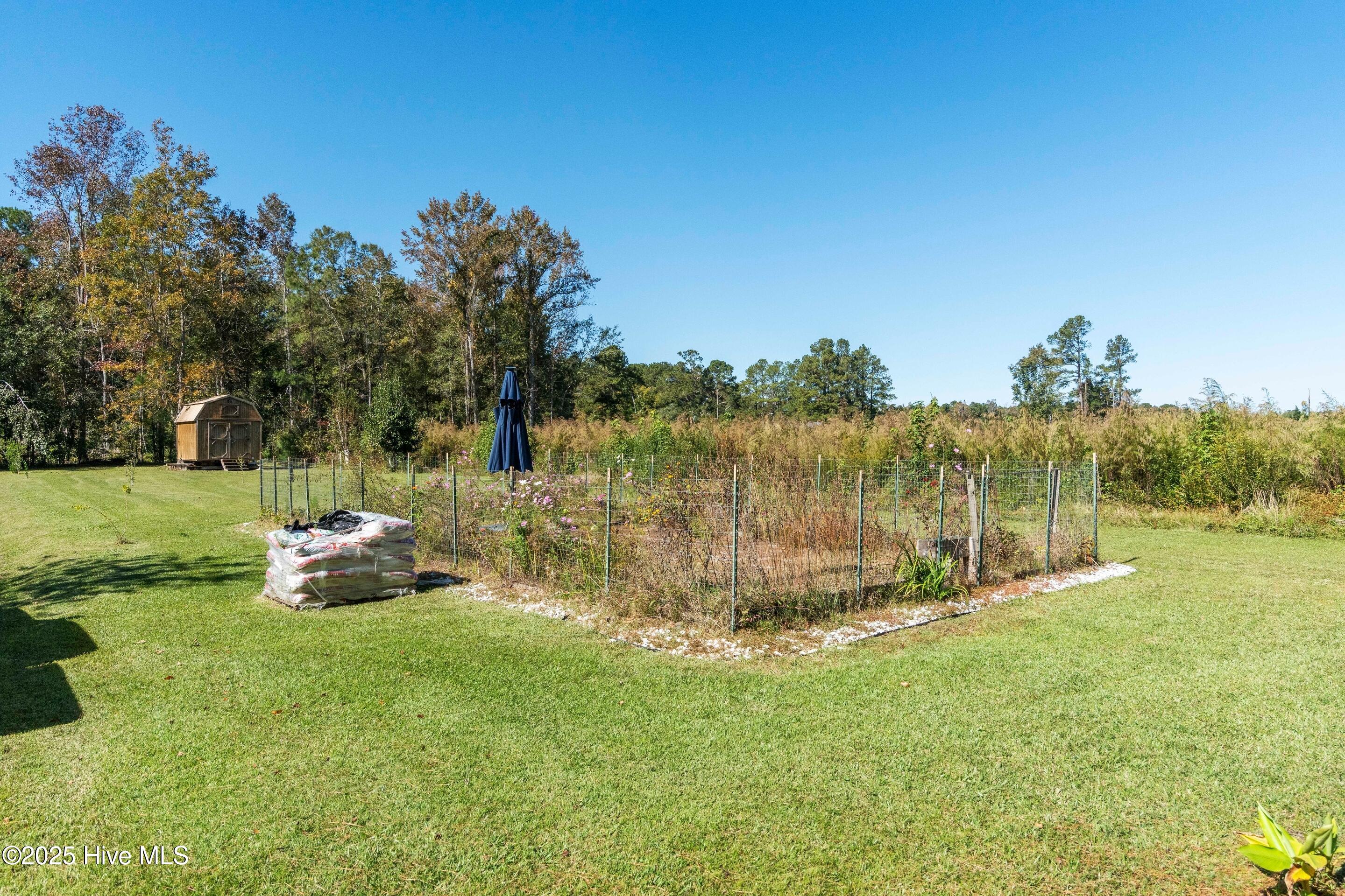 198 Jefferson Road Lake Waccamaw, NC 28450 - Photo 18 of 27 Previous wild flower garden area.