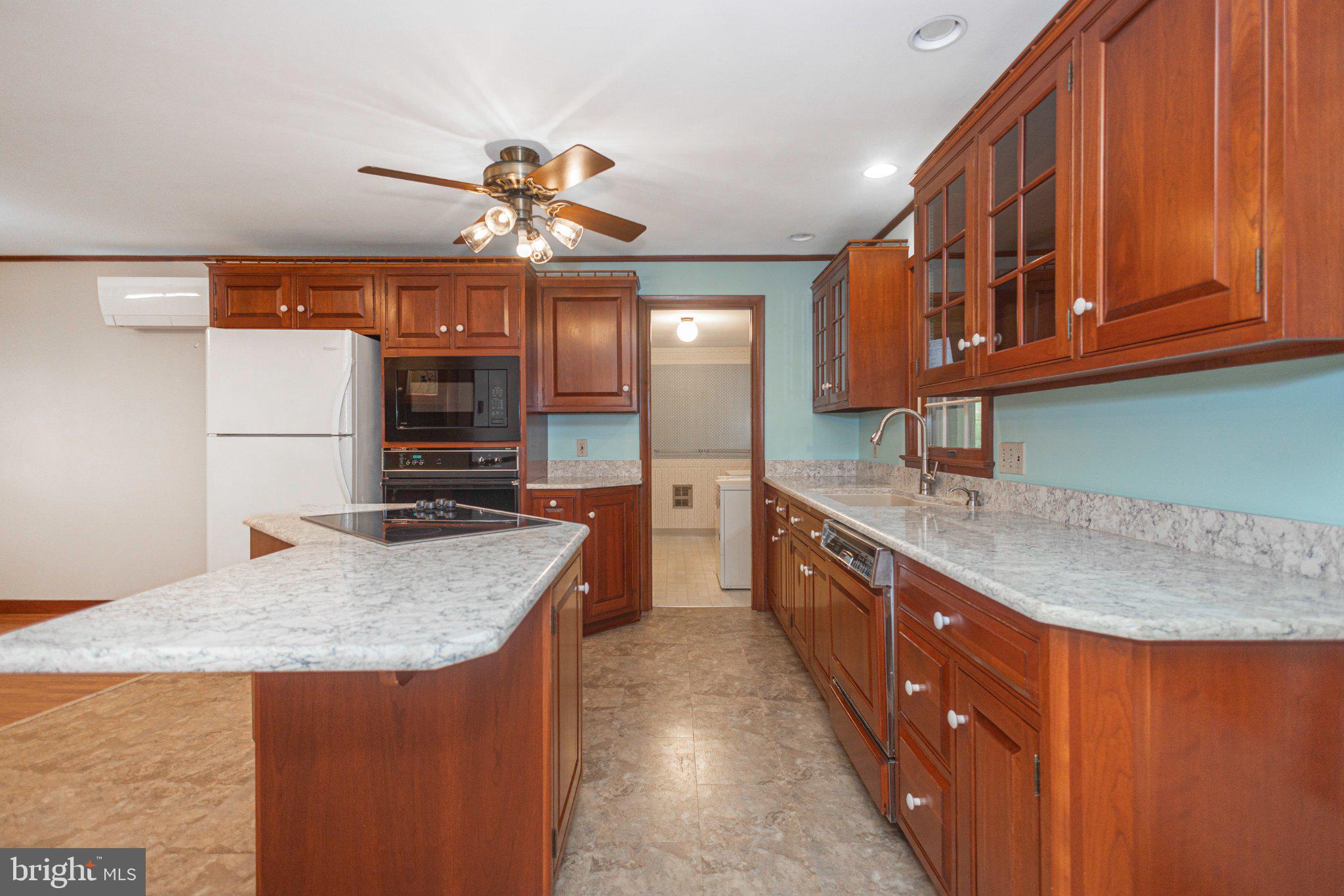 130 Webber Road Telford, PA 18969 - Photo 15 of 52 Modern kitchen with rich wood accents.