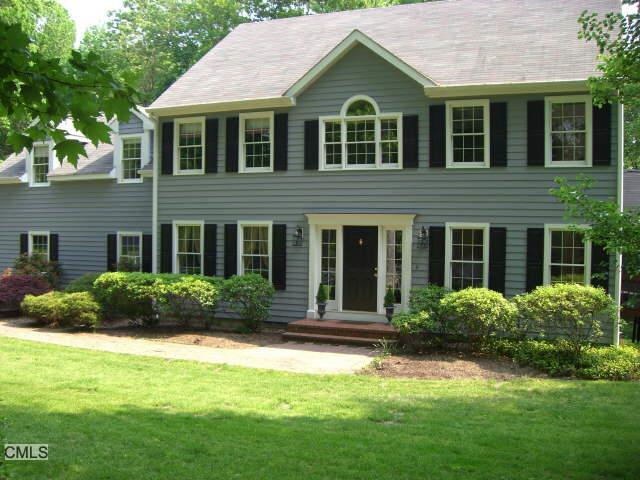 11 Split Rock Road Newtown, CT 06470 - Photo 1 of 1 a front view of a house with a yard and porch