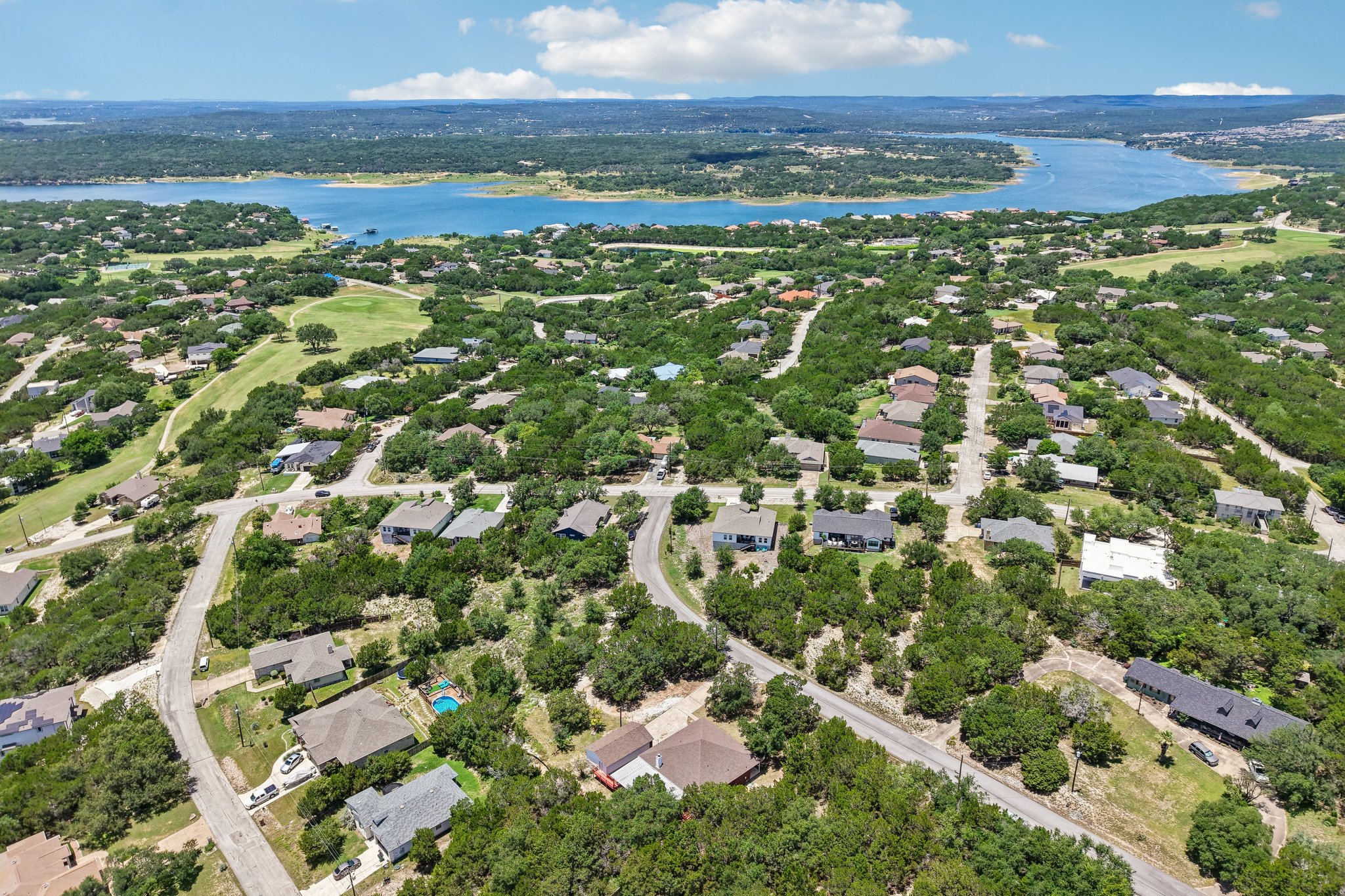 20609 Bridle Path Road Lago Vista, TX 78645 - Photo 22 of 30 Perched above a tranquil lake, this verdant neighborhood boasts ample trees and curving roadways.