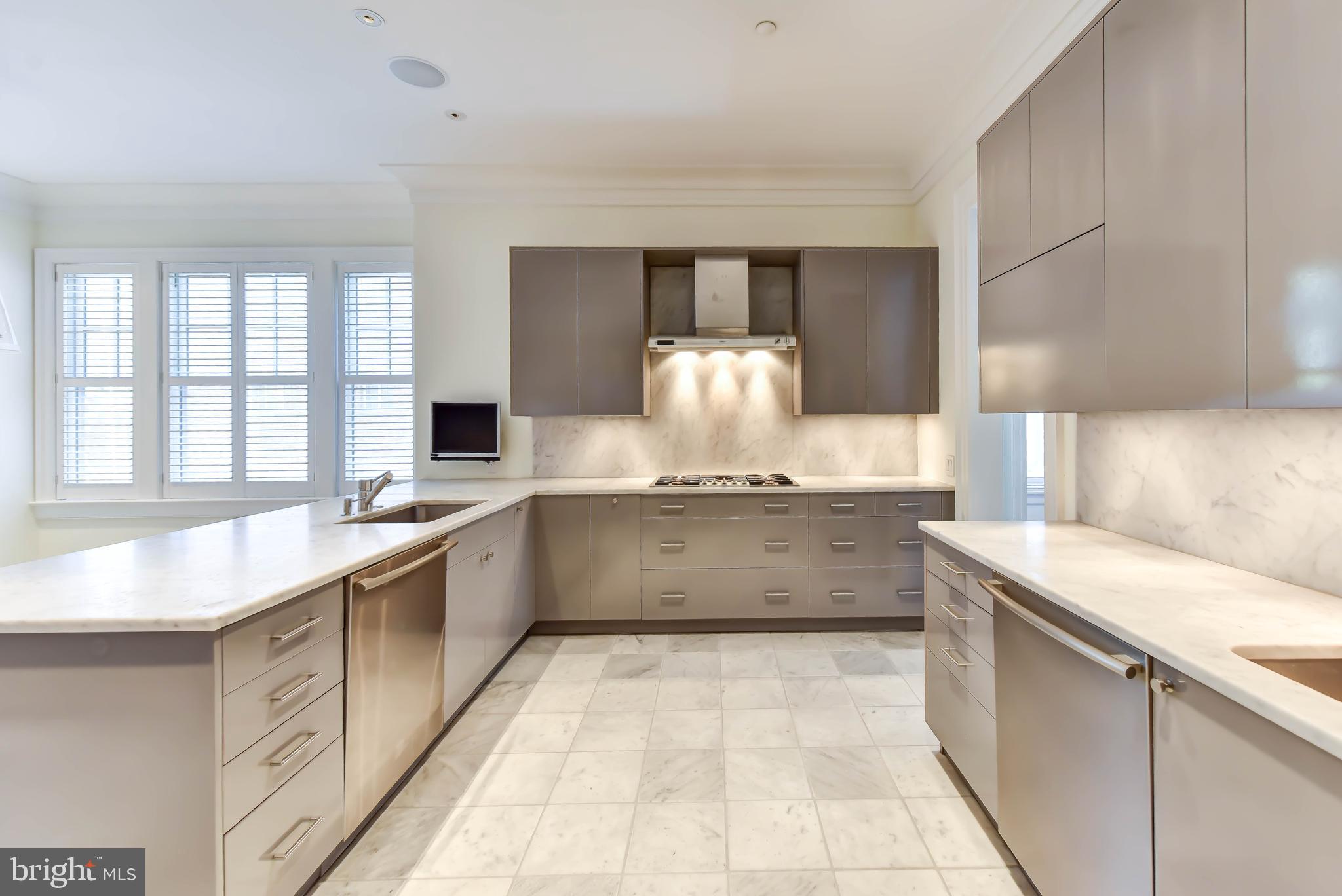 2733 Cathedral Avenue Northwest Washington, DC 20008 - Photo 11 of 36 Kitchen with double sinks and dishwashers
