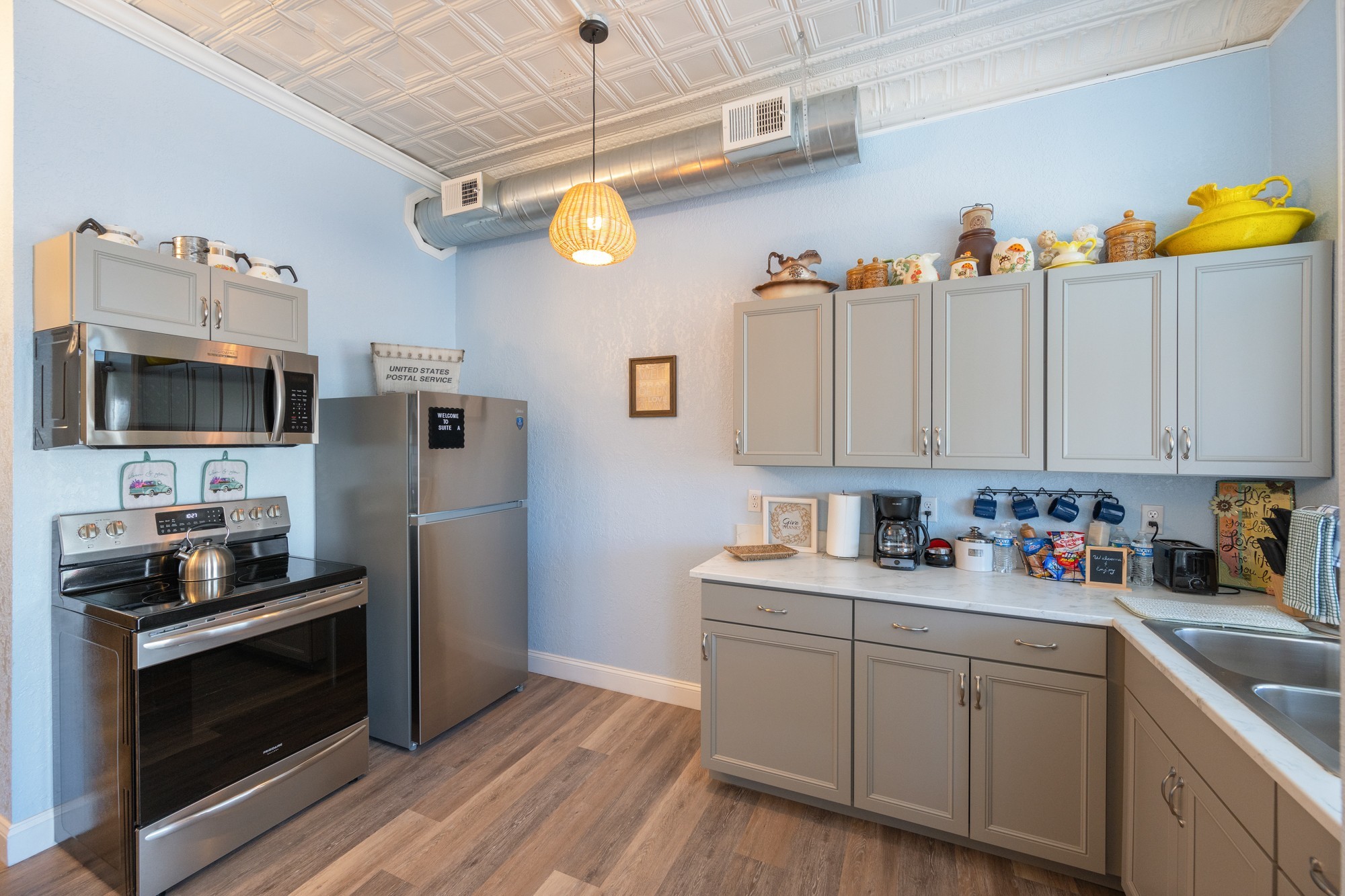 8 East Main Street Decaturville, TN 38329 - Photo 6 of 27 a kitchen with a sink cabinets and stainless steel appliances